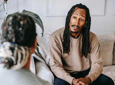 Man speaking with therapist