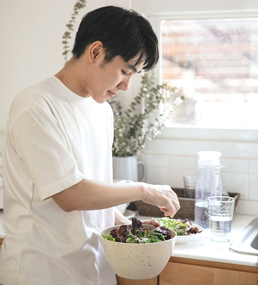Photo of man preparing a salad