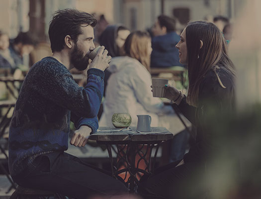 Friends talking at cafe