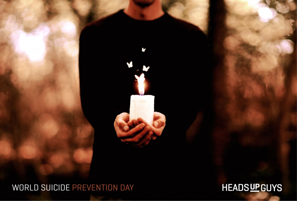 World Suicide Prevention Day 2015 image with man holding candle