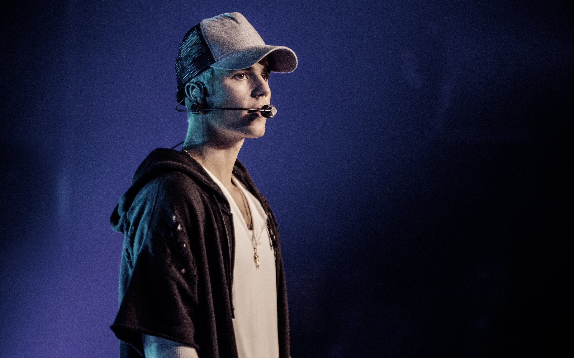 Justin Bieber wearing headset performing on stage