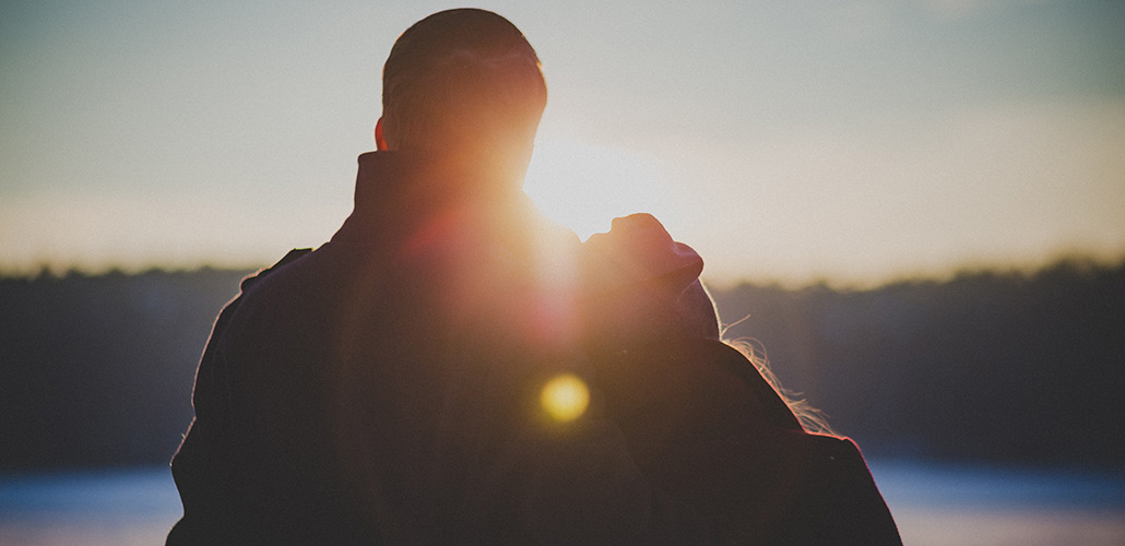 Man and woman watching sunrise