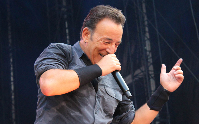 Bruce Springsteen performing on stage
