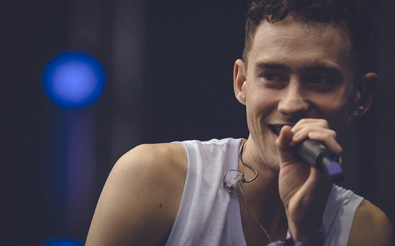 Olly Alexander performing on stage