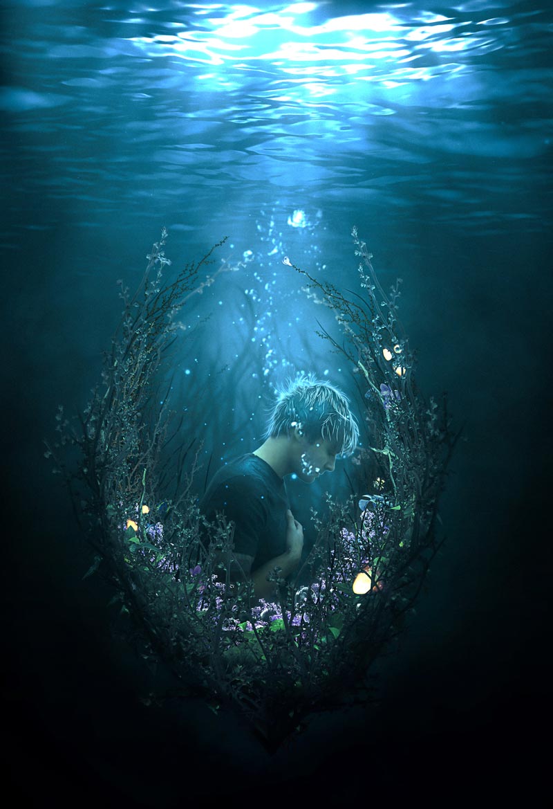 A man breathes underwater facing down