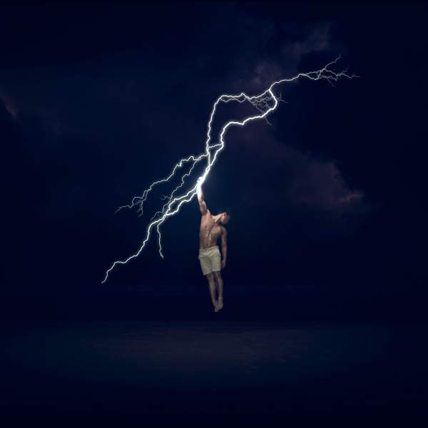 Concept photo of Adam grabbing lightning