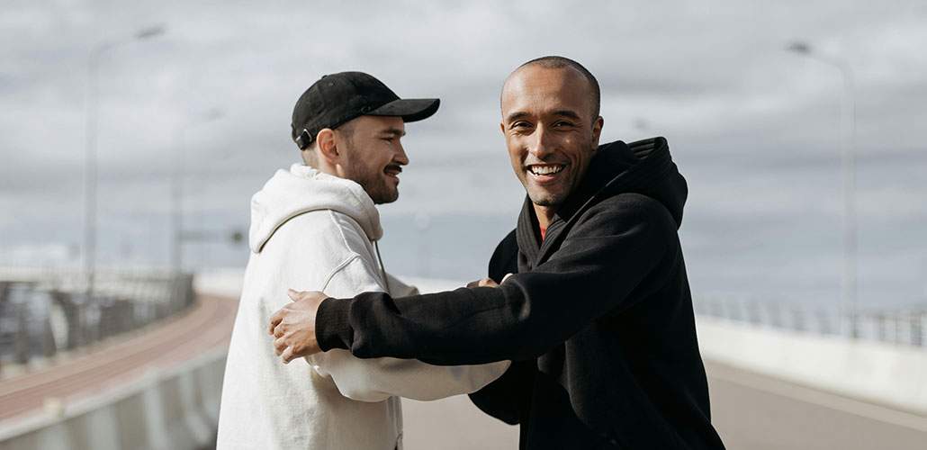 Two men clasping hands