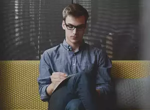 Man sitting and writing